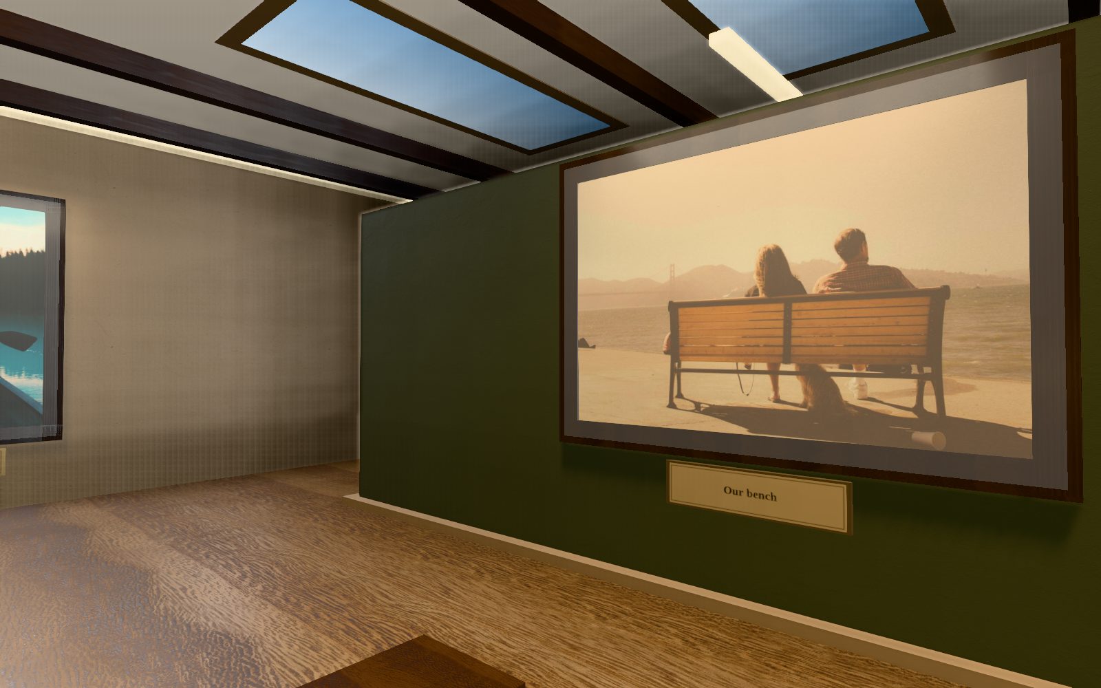 Inside an Everhall room: a photo of two people on a bench at sunset hangs on a green wall under wooden beams, its plaque reading “Our bench”.